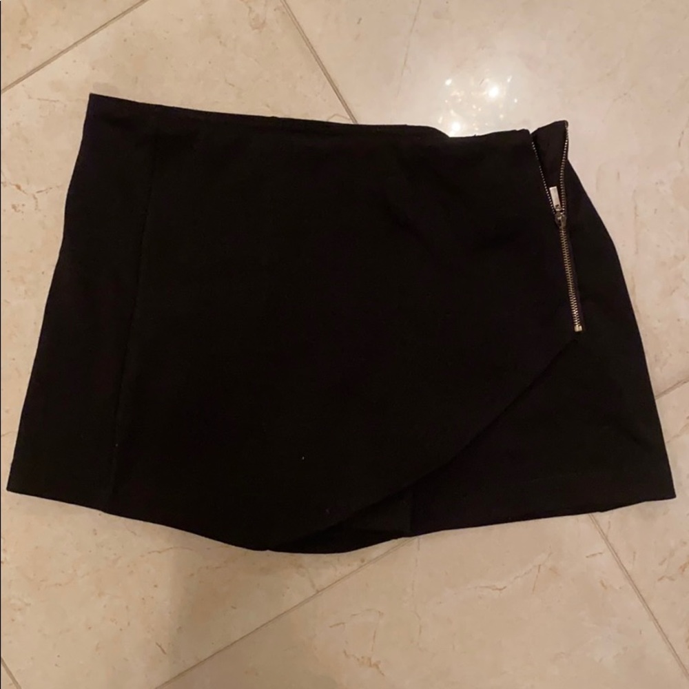 black skort with gold zipper on the side